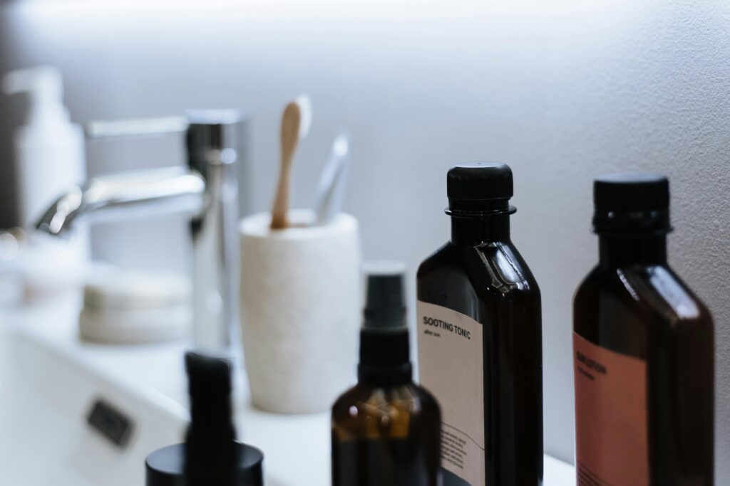 pexels photo 10221856 10221856 Close-up of modern bathroom sink counter with essential cosmetic products, offering stylish organization.